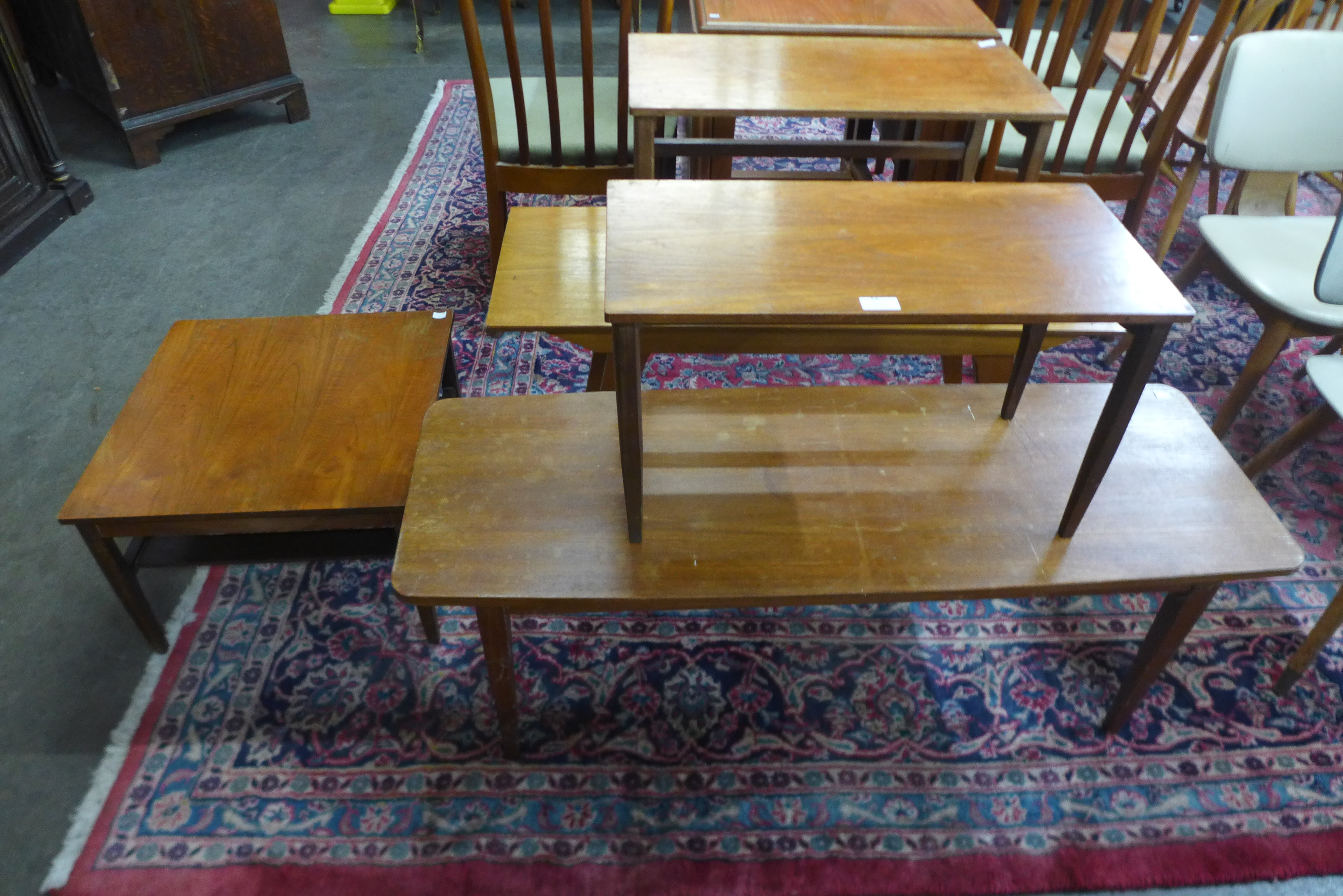 Five teak coffee tables