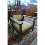 An American Arts and Crafts oak armchair, manner of Gustav Stickley