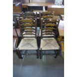 A set of four elm rush seated ladderback chairs