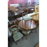 A Victorian mahogany circular tilt top breakfast table and six balloon back chairs