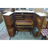 A Newcraft Ltd. teak home office cabinet