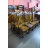 A set of twelve Carolean style hardwood dining chairs