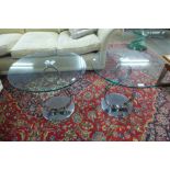 A pair of contemporary chrome and circular glass topped lamp tables