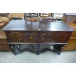 A Jacobean Revival geometric inlaid walnut dresser