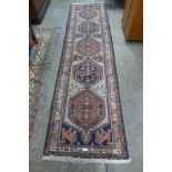 An eastern beige ground runner rug, 286 x 77cms