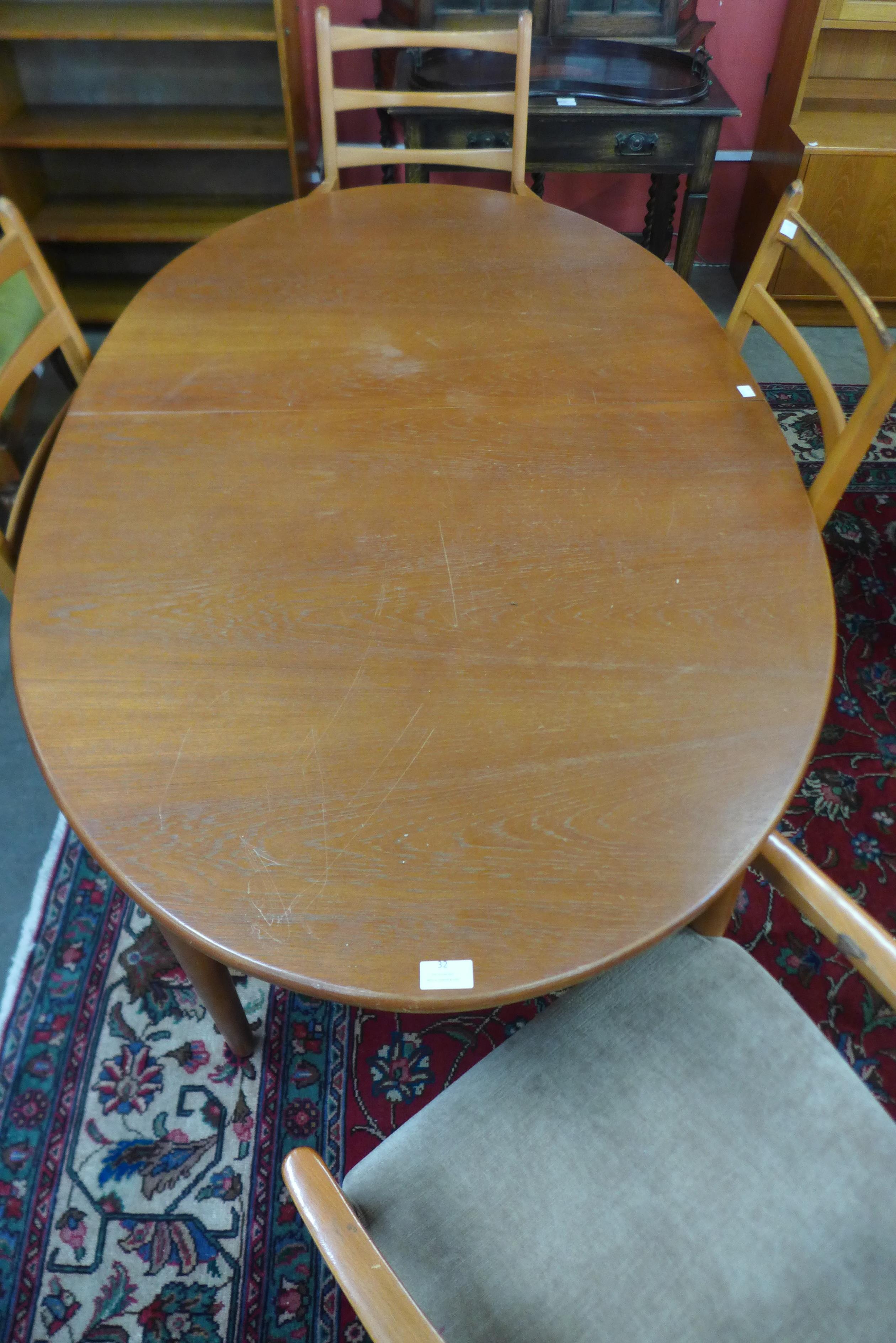 A teak extending dining table and four chairs - Image 2 of 2