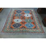 An eastern terracotta ground rug, 206 x 195cms