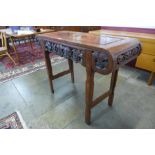 An Eastern carved hardwood and burr elm alter table