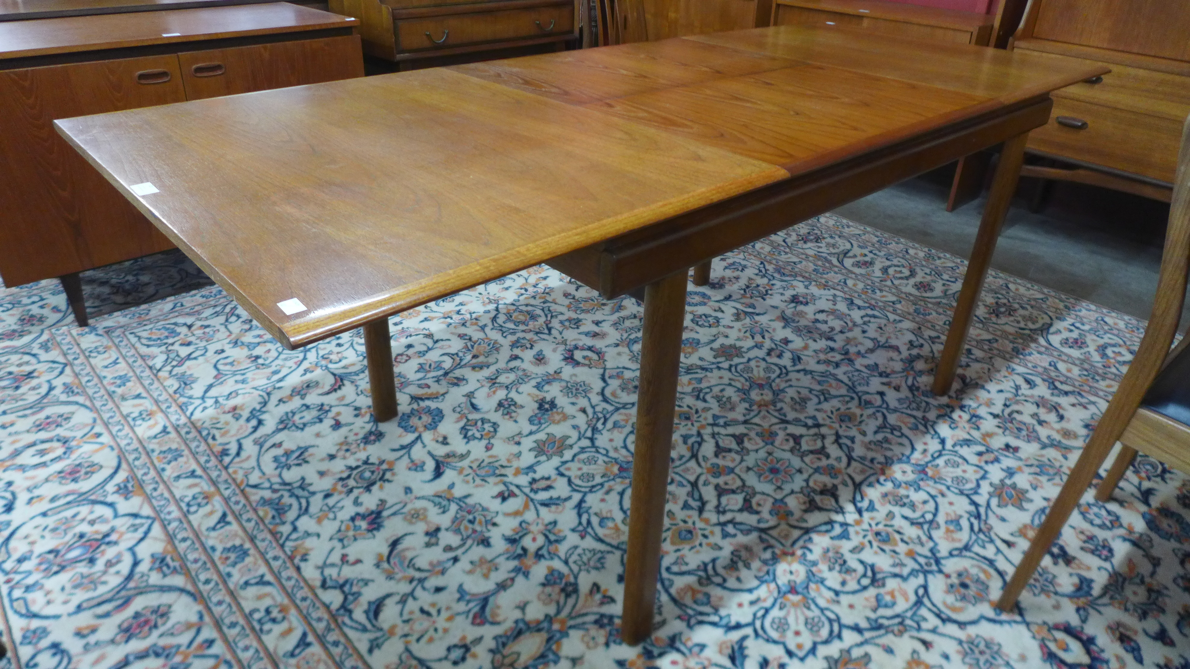 A White & Newton teak extending dining table