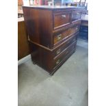 A campaign style teak and brass mounted chest of drawers