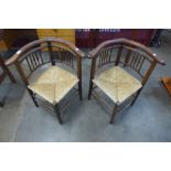 A pair of Arts and Crafts beech rush seated corner chairs