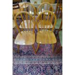 A set of four Ercol Blonde elm and beech Windsor chairs