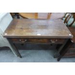 A George III mahogany rectangular fold over games table