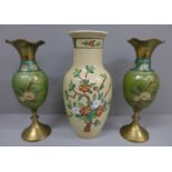 An oriental vase and a pair of vases