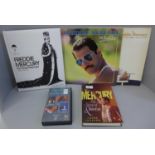 Two Freddie Mercury LP records, two books including Freddie Mercury The Great Pretender and a VHS