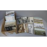 Postcards; a box of vintage to modern postcards