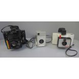 Two Polaroid Land cameras and a Kodak camera