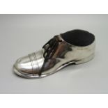 A novelty silver shoe pin cushion, worn Chester hallmark, 12cm