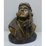 A 20th Century bronze bust of a fighter pilot, signed RS on black marble base, 18.5cm