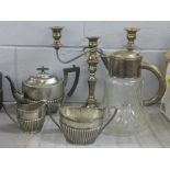 A collection of plated ware including a Walker & Hall teapot, sugar bowl and milk jug, and a