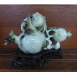 An early 20th Century jadeite pomegranate group, lid repaired