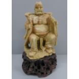 A carved soapstone figure, 20.5cm