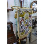 A Victorian gilt metal positional needlework and bead fire screen