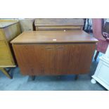 A Danish teak fitted two door music cabinet