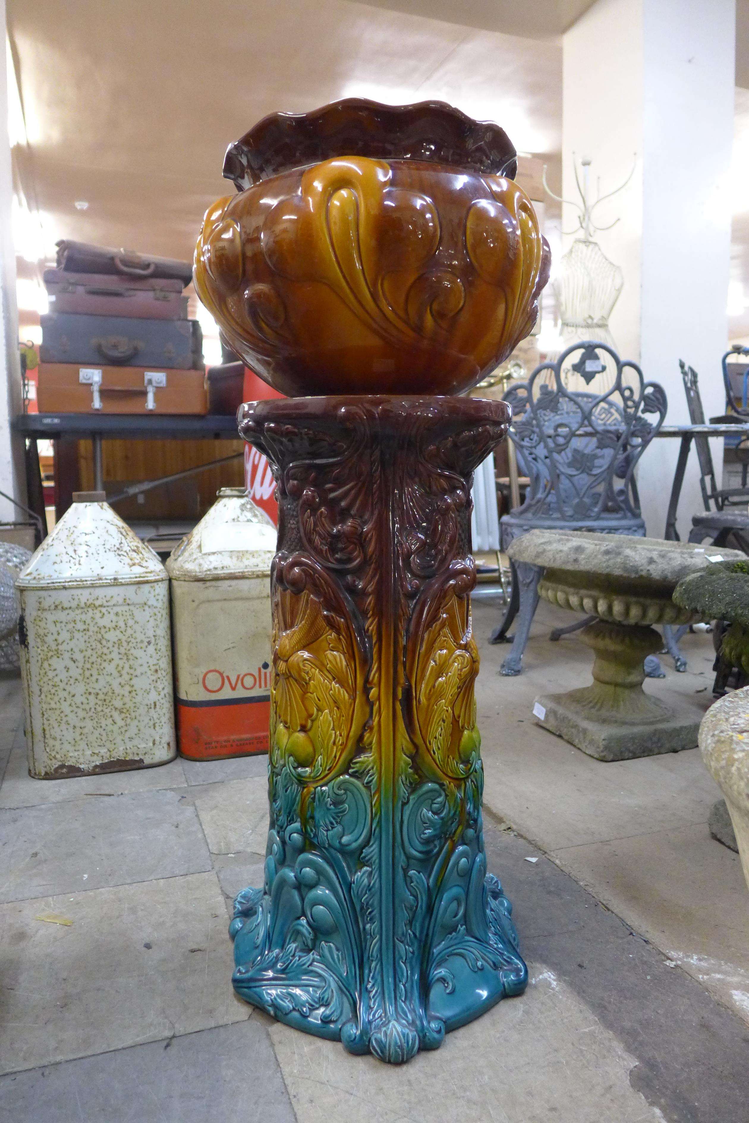 A Bretby majolica jardiniere on stand