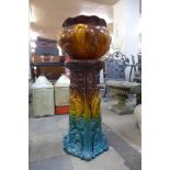 A Bretby majolica jardiniere on stand
