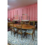 A G-Plan Fresco teak extending dining table and eight dining chairs