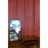 A small teak wall shelf and a mirror