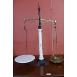 A set of Victorian cast iron and porcelain balance scales