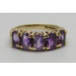 A 9ct gold and five stone amethyst ring, 3.5g, L