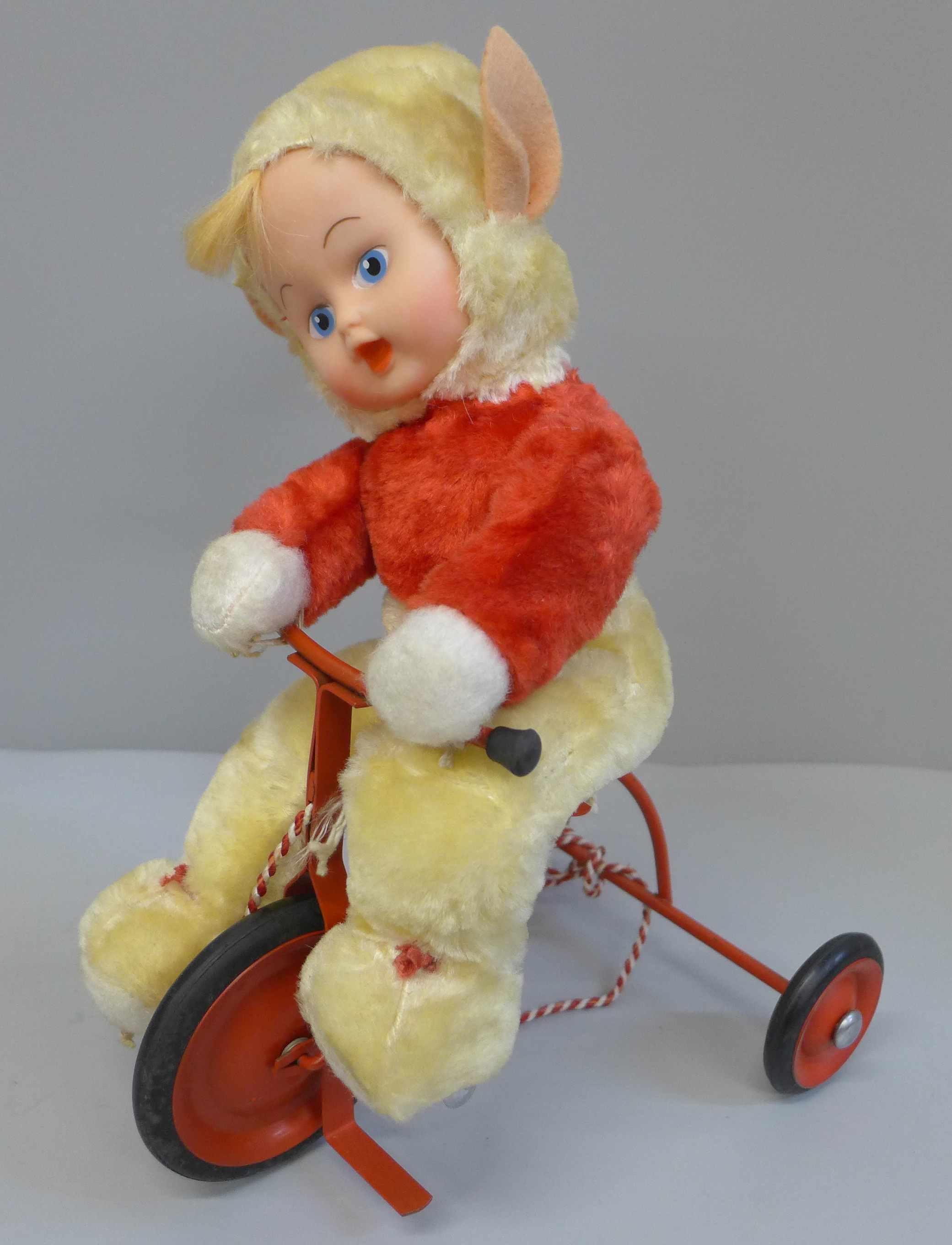 A vintage 1950's Chiltern Toys Pixie on a Trike doll, boxed