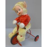 A vintage 1950's Chiltern Toys Pixie on a Trike doll, boxed