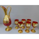 A red glass liqueur set with gilt decoration