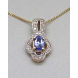 A 9ct gold, tanzanite and diamond pendant on a 9ct gold chain, 4.2g