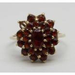 A 9ct gold, garnet cluster ring, 2.9g, N, lacking one stone