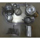 A collection of pewter and plated ware including a tray, a pewter teapot, a jug and a sugar bowl,