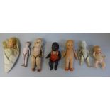 Seven small antique all bisque dolls, largest 10cm