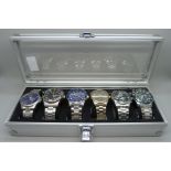 A display case with six Sekonda wristwatches (two chronograph)