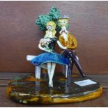 A L. Neuquelman figure of a Parisian couple on a bench