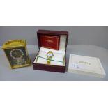 A lady's Rotary wristwatch, boxed and an Imhof brass 8-day mantel timepiece with decorative