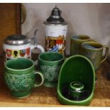 Two German steins and five pieces of green pottery including Arthur Woods **PLEASE NOTE THIS LOT