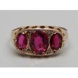 A 9ct gold, pink/red stone and rose diamond ring, Chester 1909, 1.2g, N, lacking one small diamond