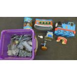 A large collection of Thomas the Tank Engine model trains and other Thomas merchandise