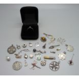 A silver and diamond ring, size Q, and assorted silver pendants, charms, etc.