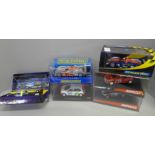 Six slot car vehicles, including Scalextric and Winco