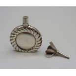 A small silver scent flask and funnel